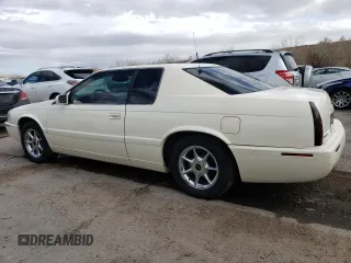 2002 Cadillac Eldorado z VIN 1G6EC12912B106675, wystawiony jako Copart lot #47630055 z przebiegiem 75 354 mil mil oraz Nie do naprawy • Non repairable. Historia ofert i sprzedaży dostępna na DreamBid. Obrazek 2.