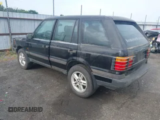 1999 Land Rover Range Rover z VIN SALPV1440XA412936, wystawiony jako IAAI lot #42271704 z przebiegiem 156 881 mil mil oraz . Historia ofert i sprzedaży dostępna na DreamBid. Obrazek 3.