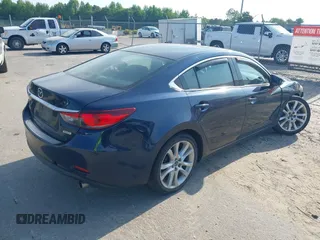 2015 Mazda 6 i Touring with VIN JM1GJ1V57F1183910, listed as a IAAI auction lot 42158716 with 234,765 mi miles. Bid and sale history available at carsss.com. Image 4.