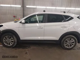 2016 Hyundai Tucson SE with VIN KM8J33A48GU117807, listed as a IAAI auction lot 41642891 with 142,371 mi miles. Bid and sale history available at carsss.com. Image 15.