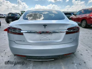 2013 Tesla Model S with VIN 5YJSA1CG5DFP03704, listed as a Copart auction lot 65143565 with Not provided miles and Clean title. Bid and sale history available at DreamBid. Image 6.