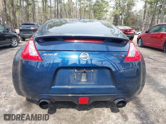 2014 Nissan 370Z Nismo z VIN JN1AZ4EH0EM631950, wystawiony jako IAAI lot #41685567 z przebiegiem 103 282 mil mil oraz . Historia ofert i sprzedaży dostępna na DreamBid. Obrazek 16.