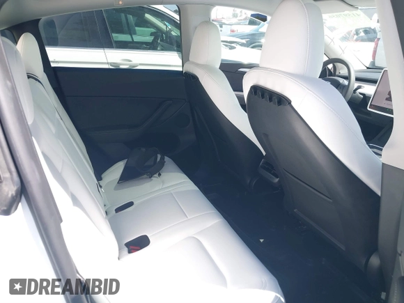 2024 Tesla Model Y with VIN 7SAYGDED2RF017448, listed as a IAAI auction lot 41597056 with 9,702 mi miles and . Bid and sale history available at DreamBid. Image 8.