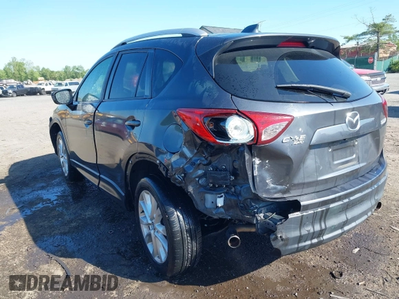 2014 Mazda CX-5 Grand Touring with VIN JM3KE4DY2E0312952, listed as a IAAI auction lot 42138721 with 99,993 mi miles and . Bid and sale history available at DreamBid. Image 3.