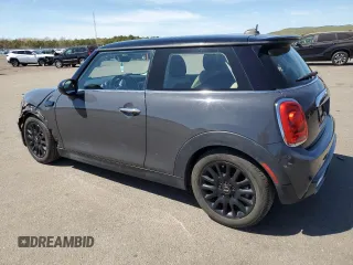 2014 MINI Hardtop S with VIN WMWXM7C54ET985344, listed as a Copart auction lot 55242945 with 87,017 mi miles and Salvage Title. Bid and sale history available at DreamBid. Image 2.