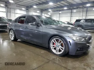2014 BMW 3 Series 335i xDrive with VIN WBA3B9C59EP458568, listed as a Copart auction lot 61133085 with 177,009 mi miles and Salvage title. Bid and sale history available at DreamBid. Image 4.