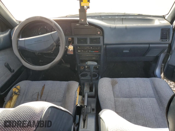 1988 Toyota Corolla with VIN JT2AE92E9J3140852, listed as a Copart auction lot 74968874 with 169,427 mi miles and Salvage title. Bid and sale history available at DreamBid. Image 8.