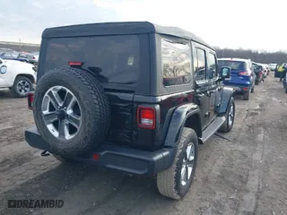2019 Jeep Wrangler Unlimited Sahara with VIN 1C4HJXEG3KW626950, listed as a IAAI auction lot 41779814 with 50,613 mi miles. Bid and sale history available at carsss.com. Image 4.