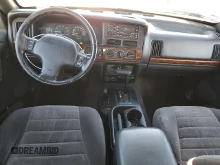 1998 Jeep Grand Cherokee Laredo с VIN 1J4GZ58YXWC134866, выставлен на аукционе Copart как лот 84514074 с пробегом 193 802 миль миль и Списание • Salvage title. История ставок и продаж доступна на DreamBid. Изображение 8.