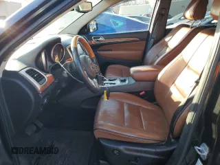 2013 Jeep Grand Cherokee Overland with VIN 1C4RJFCTXDC525097, listed as a Copart auction lot 42250875 with 214,368 mi miles and Salvage Title. Bid and sale history available at carsss.com. Image 7.