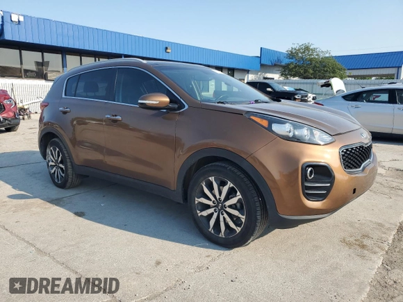 2017 Kia Sportage EX with VIN KNDPNCAC9H7054281, listed as a Copart auction lot 60571945 with 106,516 mi miles and Salvage title. Bid and sale history available at DreamBid. Image 4.
