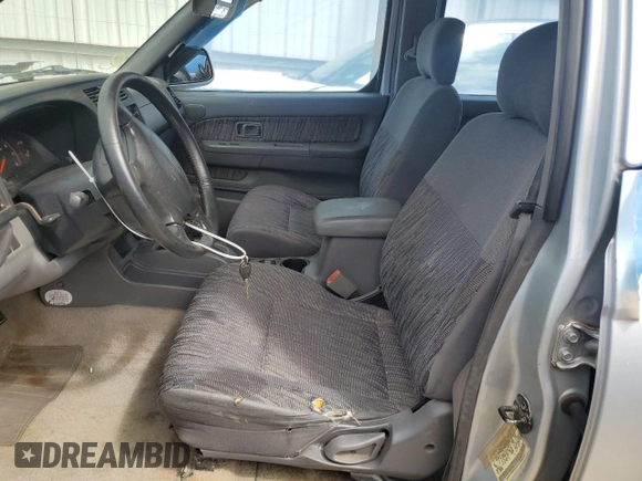 2000 Nissan Frontier XE with VIN 1N6ED27T8YC367452, listed as a Copart auction lot 55866345 with 242,945 mi miles and Salvage title. Bid and sale history available at DreamBid. Image 7.