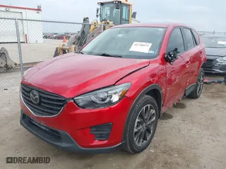 2016 Mazda CX-5 Grand Touring with VIN JM3KE2DYXG0621267, listed as a IAAI auction lot 41710973 with 151,636 mi miles. Bid and sale history available at carsss.com. Image 18.