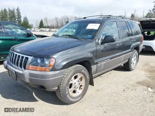 1999 Jeep Grand Cherokee Laredo with VIN 1J4GW58S6XC524451, listed as a IAAI auction lot 41741007 with 162,441 mi miles. Bid and sale history available at carsss.com. Image 2.