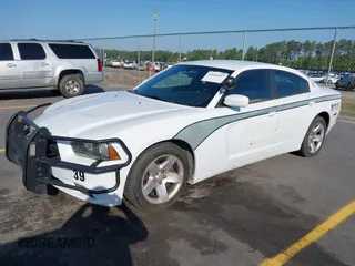 2014 Dodge Charger Police with VIN 2C3CDXAT8EH348719, listed as a IAAI auction lot 42026437 with 140,573 mi miles and . Bid and sale history available at DreamBid. Image 2.