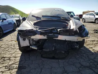2025 Tesla Model 3 Long Range with VIN 5YJ3E1EA1SF878806, listed as a Copart auction lot 50427005 with 9,790 mi miles and Salvage Title. Bid and sale history available at DreamBid. Image 5.