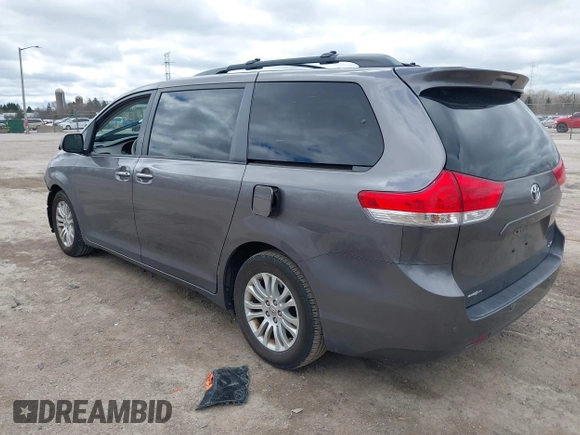 2014 Toyota Sienna XLE with VIN 5TDYK3DC0ES422700, listed as a IAAI auction lot 42049181 with 147,498 mi miles. Bid and sale history available at carsss.com. Image 3.
