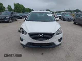 2016 Mazda CX-5 Sport with VIN JM3KE2BY1G0875484, listed as a IAAI auction lot 41838122 with 166,986 mi miles. Bid and sale history available at carsss.com. Image 12.