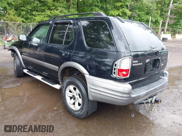 2003 Isuzu Rodeo with VIN 4S2DM58W234312253, listed as a IAAI auction lot 42319453 with 187,939 mi miles and . Bid and sale history available at DreamBid. Image 3.