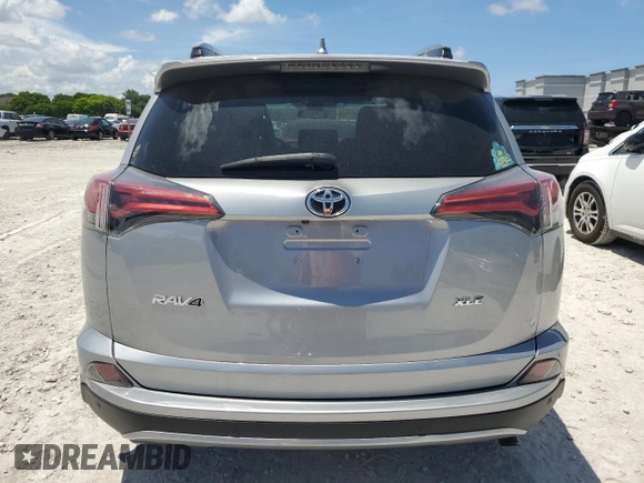 2018 Toyota RAV4 XLE with VIN 2T3WFREV7JW423768, listed as a Copart auction lot 61841875 with 111,991 mi miles and Salvage title. Bid and sale history available at DreamBid. Image 6.
