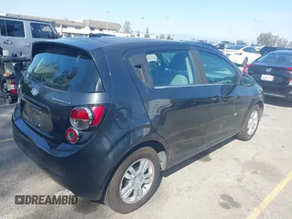 2014 Chevrolet Sonic LT with VIN 1G1JC6SG4E4118781, listed as a IAAI auction lot 41862192 with 124,375 mi miles. Bid and sale history available at carsss.com. Image 4.