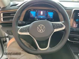 2024 Volkswagen Atlas SE with VIN 1V2HR2CA2RC556331, listed as a IAAI auction lot 42806429 with 25,239 mi miles and . Bid and sale history available at DreamBid. Image 2.