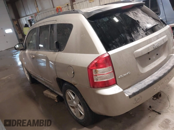 2010 Jeep Compass Sport with VIN 1J4NF4FB7AD501587, listed as a IAAI auction lot 41514419 with 154,826 mi miles. Bid and sale history available at carsss.com. Image 3.