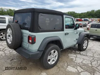 2023 Jeep Wrangler Sport with VIN 1C4HJXAG0PW595881, listed as a Copart auction lot 65590025 with 19,597 mi miles and Salvage title. Bid and sale history available at DreamBid. Image 3.