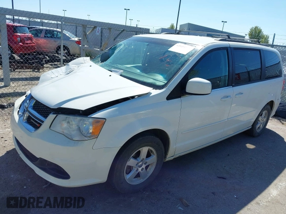 2012 Dodge Grand Caravan SXT with VIN 2C4RDGCGXCR365194, listed as a IAAI auction lot 42058530 with 131,059 mi miles and . Bid and sale history available at DreamBid. Image 2.