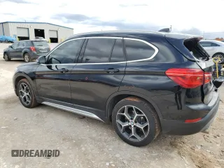 2018 BMW X1 xDrive28i with VIN WBXHT3C32J5L28030, listed as a Copart auction lot 47087415 with 100,708 mi miles and Salvage Title. Bid and sale history available at carsss.com. Image 2.