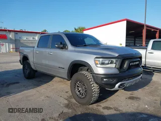 2021 Ram 1500 Rebel with VIN 1C6SRFLT3MN778445, listed as a IAAI auction lot 42209255 with 48,125 mi miles and . Bid and sale history available at DreamBid. Image 1.
