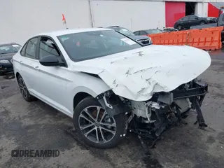 2023 Volkswagen Jetta Sport z VIN 3VWBM7BU5PM023803, wystawiony jako IAAI lot #41157025 z przebiegiem 26 734 mil mil oraz . Historia ofert i sprzedaży dostępna na DreamBid. Obrazek 1.