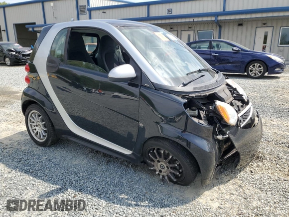 2013 Smart fortwo Pure with VIN WMEEJ3BA9DK670264, listed as a Copart auction lot 52817215 with 51,434 mi miles and Salvage Title. Bid and sale history available at DreamBid. Image 4.