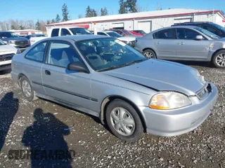 1997 Honda Civic DX with VIN 1HGEJ6223VL095214, listed as a IAAI auction lot 41560717 with 257,409 mi miles. Bid and sale history available at carsss.com. Image 1.