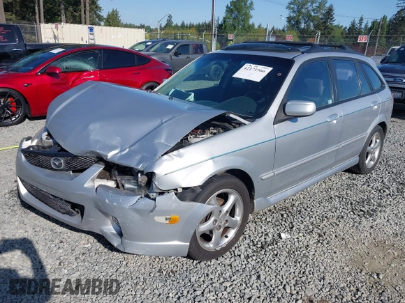 2002 Mazda Protege z VIN JM1BJ246221493337, wystawiony jako IAAI lot #42171966 z przebiegiem 244 609 mil mil oraz . Historia ofert i sprzedaży dostępna na DreamBid. Obrazek 2.