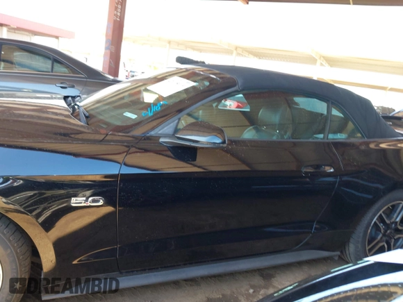 2019 Ford Mustang GT Premium z VIN 1FATP8FF7K5126175, wystawiony jako IAAI lot #42015019 z przebiegiem 91 335 mil mil oraz . Historia ofert i sprzedaży dostępna na DreamBid. Obrazek 14.