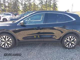 2020 Ford Escape Titanium Hybrid z VIN 1FMCU9DZ9LUC35844, wystawiony jako IAAI lot #42058275 z przebiegiem 74 205 mil mil oraz . Historia ofert i sprzedaży dostępna na DreamBid. Obrazek 14.
