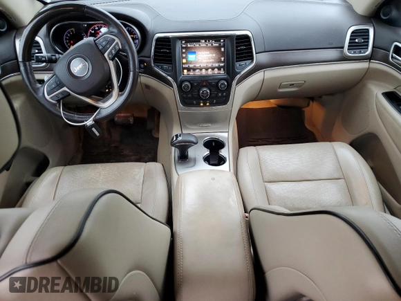 2014 Jeep Grand Cherokee Overland with VIN 1C4RJFCG9EC572237, listed as a Copart auction lot 53864865 with 90,657 mi miles and Salvage Title. Bid and sale history available at DreamBid. Image 8.