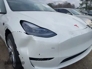 2023 Tesla Model Y Long Range with VIN 7SAYGDEE2PF765395, listed as a IAAI auction lot 41688080 with 27,792 mi miles and . Bid and sale history available at DreamBid. Image 21.