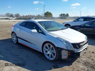 2016 Cadillac ELR z VIN 1G6RL1E41GU127457, wystawiony jako IAAI lot #41413782 z przebiegiem 73 271 mil mil oraz . Historia ofert i sprzedaży dostępna na DreamBid. Obrazek 1.