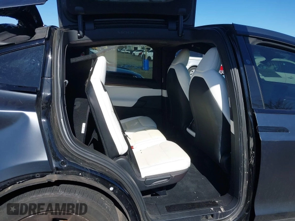 2022 Tesla Model X with VIN 7SAXCDE52NF345835, listed as a IAAI auction lot 41823522 with 24,401 mi miles and . Bid and sale history available at DreamBid. Image 8.