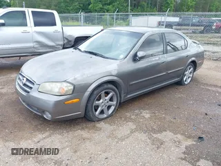 2002 Nissan Maxima GXE z VIN JN1DA31DX2T418118, wystawiony jako IAAI lot #42344516 z przebiegiem 285 061 mil mil oraz . Historia ofert i sprzedaży dostępna na DreamBid. Obrazek 2.