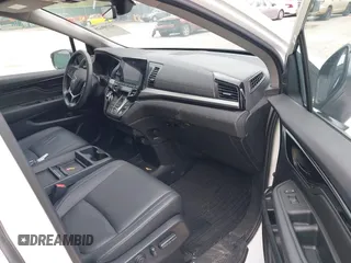 2023 Honda Odyssey Touring with VIN 5FNRL6H88PB079716, listed as a IAAI auction lot 42208628 with 26,679 mi miles and . Bid and sale history available at DreamBid. Image 5.