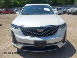 2024 Cadillac XT6 FWD Luxury z VIN 1GYKPAR49RZ739032, wystawiony jako IAAI lot #41985694 z przebiegiem 20 595 mil mil oraz . Historia ofert i sprzedaży dostępna na DreamBid. Obrazek 12.