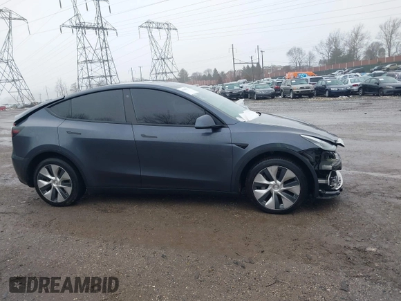 2022 Tesla Model Y Long Range z VIN 7SAYGDEE9NF331410, wystawiony jako IAAI lot #41580172 z przebiegiem 81 794 mil mil oraz . Historia ofert i sprzedaży dostępna na DreamBid. Obrazek 13.