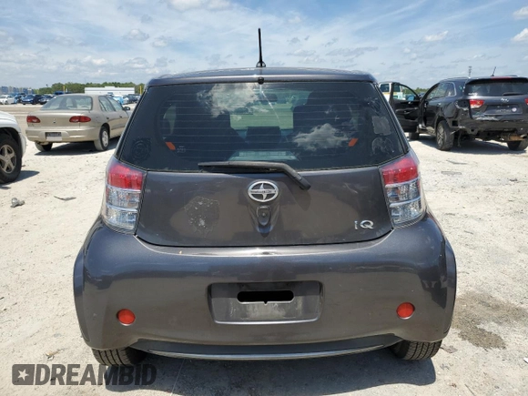 2012 Scion iQ with VIN JTNJJXB06CJ011117, listed as a Copart auction lot 52694345 with 94,547 mi miles and Salvage Title. Bid and sale history available at carsss.com. Image 6.