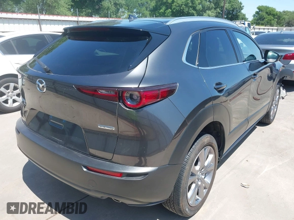 2022 Mazda CX-30 S Premium with VIN 3MVDMBDL5NM416649, listed as a IAAI auction lot 41990745 with 13,923 mi miles and . Bid and sale history available at DreamBid. Image 4.