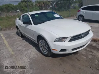 2012 Ford Mustang Premium with VIN 1ZVBP8AMXC5271916, listed as a IAAI auction lot 42187185 with 103,379 mi miles and . Bid and sale history available at DreamBid. Image 1.