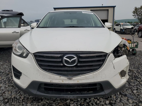 2016 Mazda CX-5 Sport с VIN JM3KE4BY4G0899953, выставлен на аукционе Copart как лот 57269035 с пробегом 196 158 миль миль и Списание • Salvage title. История ставок и продаж доступна на DreamBid. Изображение 5.