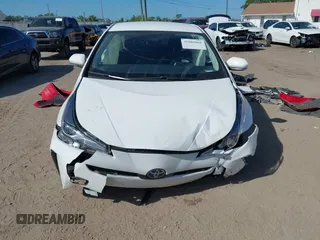 2021 Toyota Prius L Eco with VIN JTDKAMFU2M3147562, listed as a IAAI auction lot 41882066 with 99,491 mi miles. Bid and sale history available at carsss.com. Image 6.